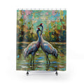 A shower curtain featuring an impressionistic painting of two brolgas standing in shallow water, with a colourful textured background and the text 'OCEAN TO OUTBACK BAREFOOT' across the top. The curtain is shown hanging from silver rings on a white rod, with a white tub base and feet visible below.