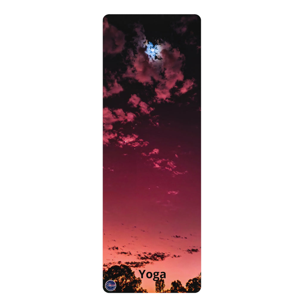 A tall, narrow yoga mat featuring a scenic sunset sky print with pink, red, and dark purple clouds, with the word 'Yoga' printed at the bottom.