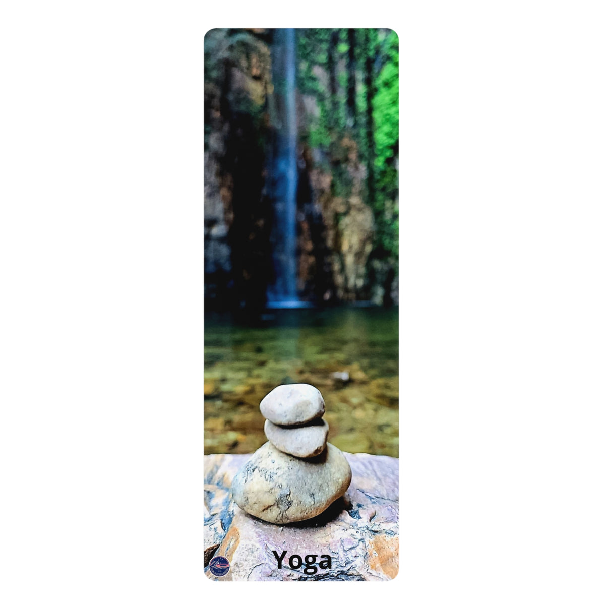 A tall, narrow yoga mat featuring a scenic print of a waterfall in a forest, with stacked stones in the foreground and the word 'Yoga' printed at the bottom.