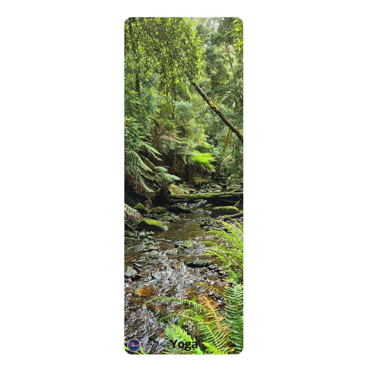 A tall rectangular yoga mat featuring a scenic forest print with a stream, ferns, moss, and trees. The mat has the word 'Yoga' printed near the bottom, shown against a plain white background.