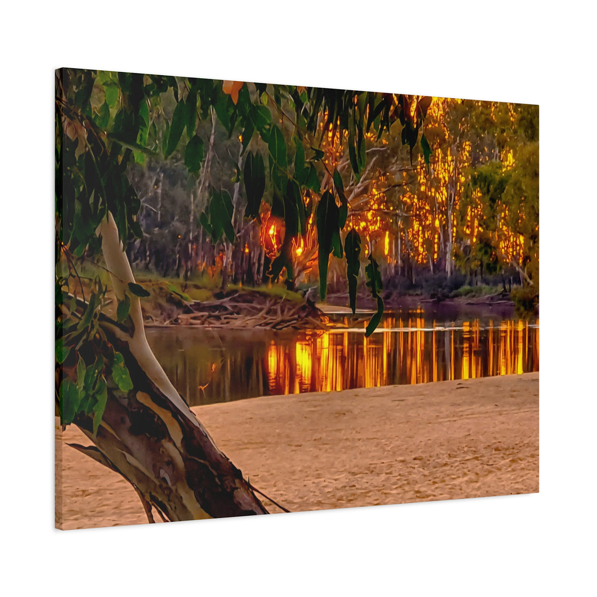A rectangular canvas wall art print showing a warm-toned forest riverside scene with golden sunlight through trees, green leaves hanging in the foreground, sandy bank, and reflections on the water, photographed against a plain white background.